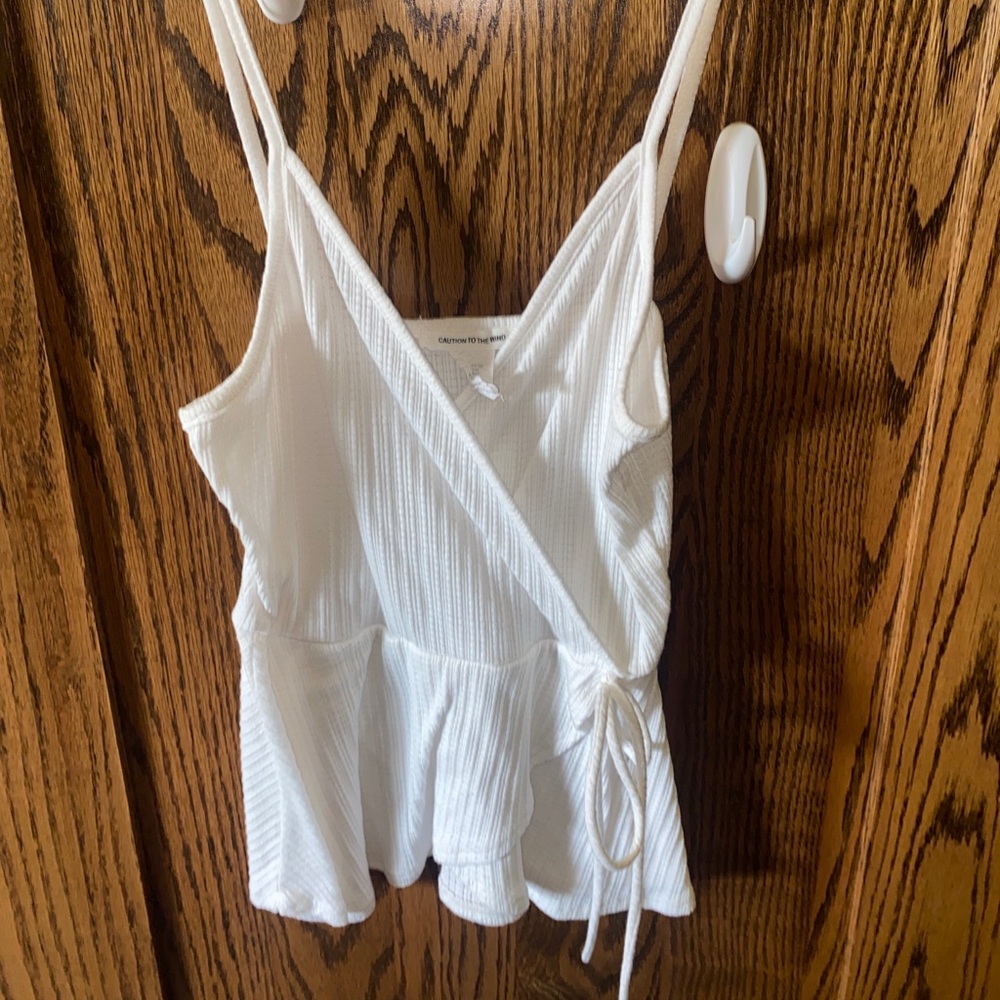 Caution to the wind white tank top